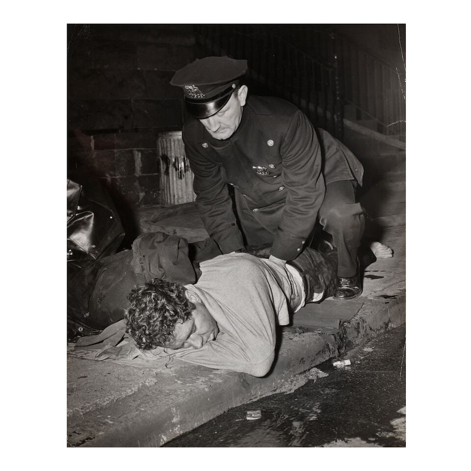 Weegee (Arthur Fellig) (1899-1968); Untitled (Cop giving artificial respiration); (1 of 1)