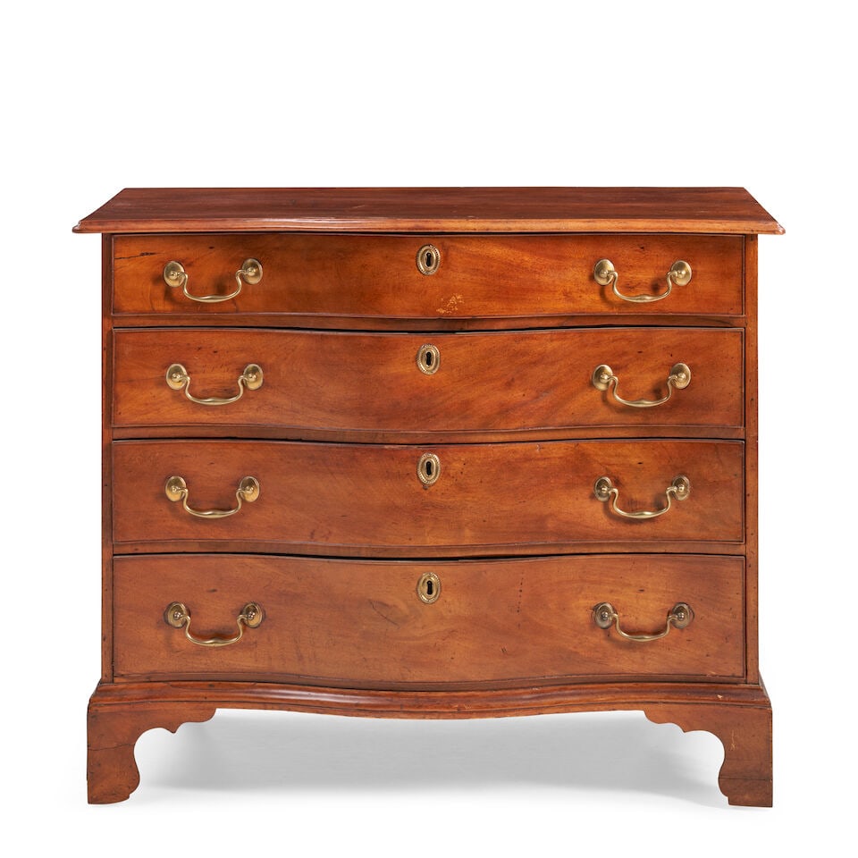 Chippendale Mahogany Dresser New England, late 18th century: Chippendale Mahogany Dresser New England, late 18th century Single-board top with thumb-molded edge and serpentine front overhanging conforming case of four graduated drawers raised on shaped bracket