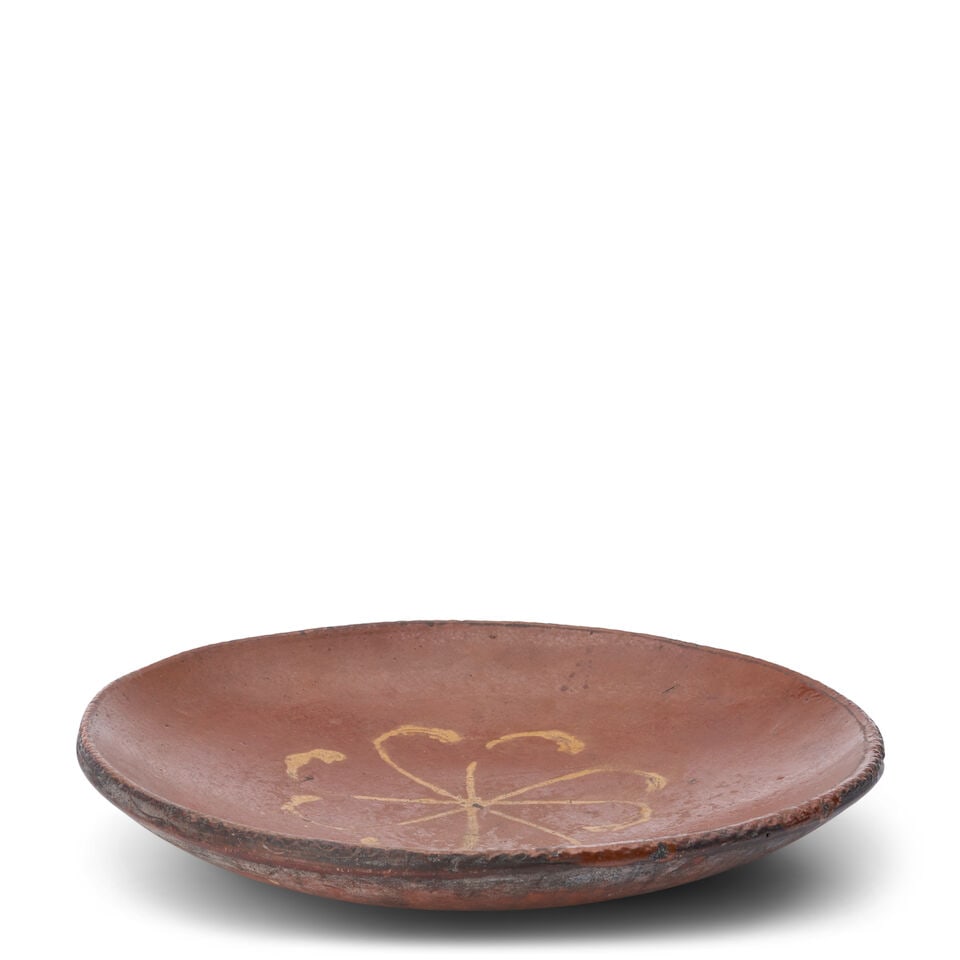 Slip-decorated Redware Charger United States, early 19th century: Slip-decorated Redware Charger United States, early 19th century Slab-molded red earthenware plate with coggled rim centering a pinwheel motif in yellow slip, diam. 13 1/2, ht. 2 1/4 in. For further