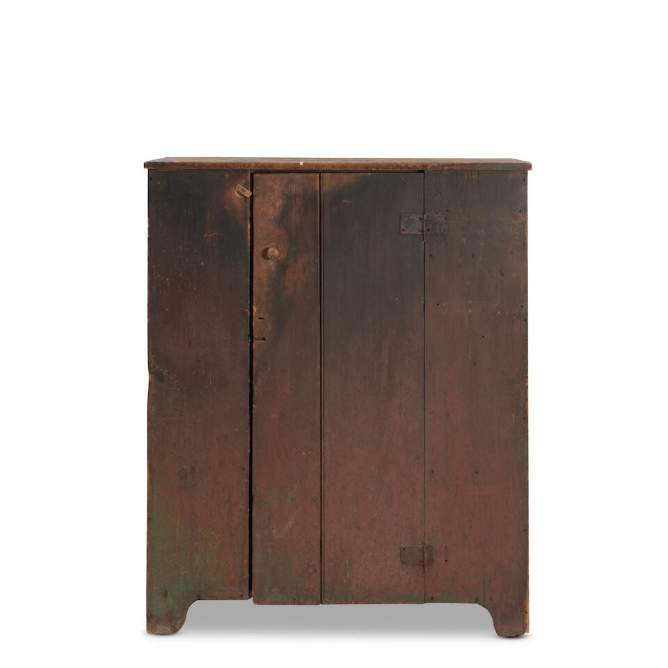 Country Painted Pine Cupboard Northeastern United States, early 19th century: Country Painted Pine Cupboard Northeastern United States, early 19th century with visible areas of older green paint below an old but later red paint, 109cm wide, 43cm deep, 134cm high (43 1/2in wide,