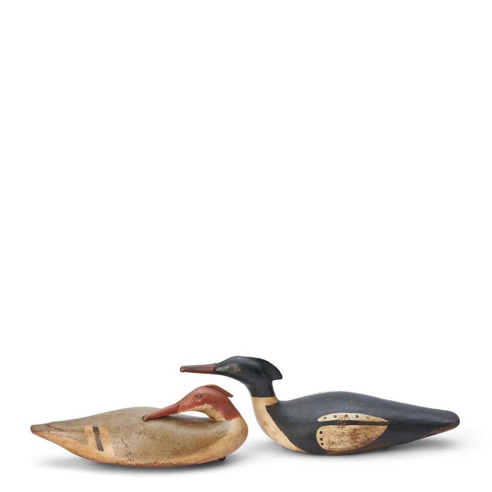 Two Painted Wooden Duck Decoys Andre Broussard, Quebec, Canada, 20th century: Two Painted Wooden Duck Decoys Andre Broussard, Quebec, Canada, 20th century each with metal eye hooks and weights affixed to the bottom wd. 178, dp. 6, ht. 7 in. For further information on this lot