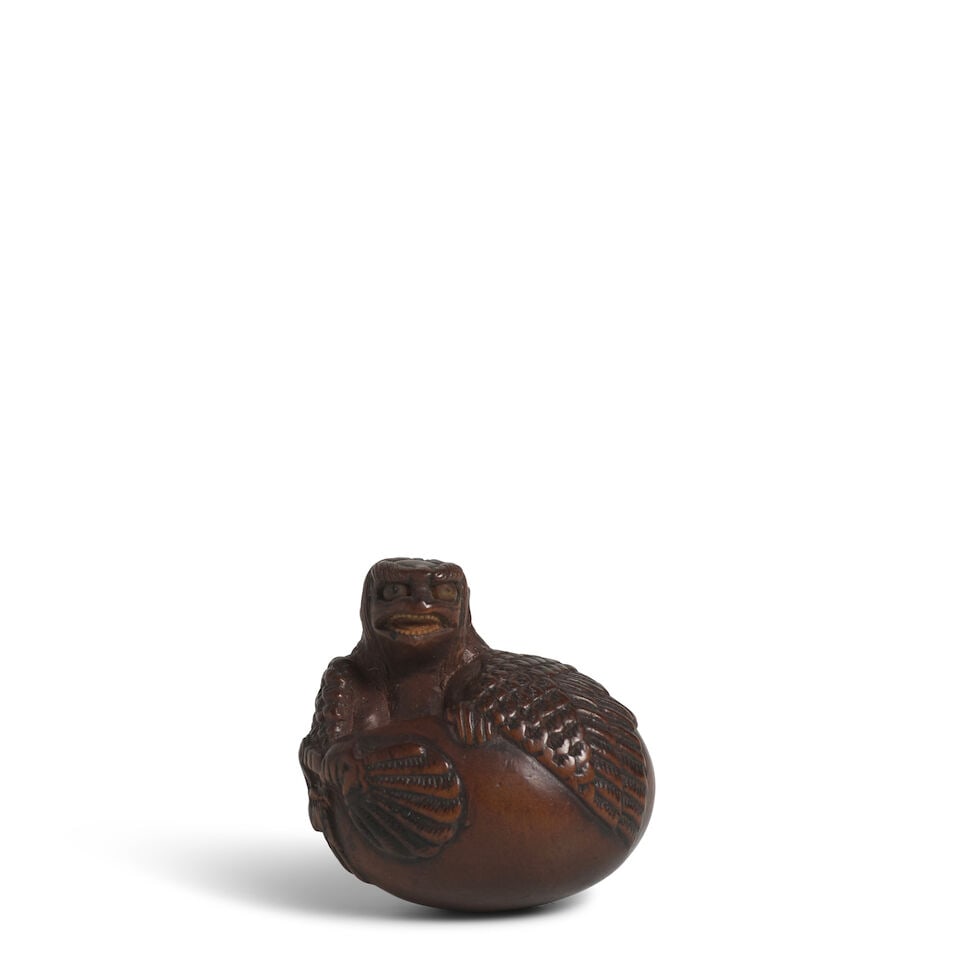 A WOOD NETSUKE OF A HATCHLING TENGU Edo period (1615-1868), 18th/19th century