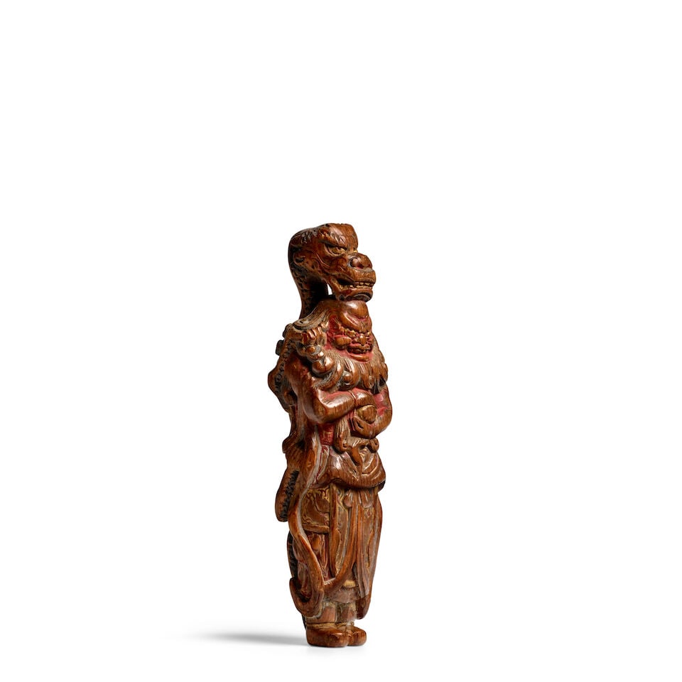 ATTRIBUTED TO YOSHIMURA SHŪZAN (ACTIVE LATE 18TH CENTURY) A Large Painted Wood Netsuke of R...