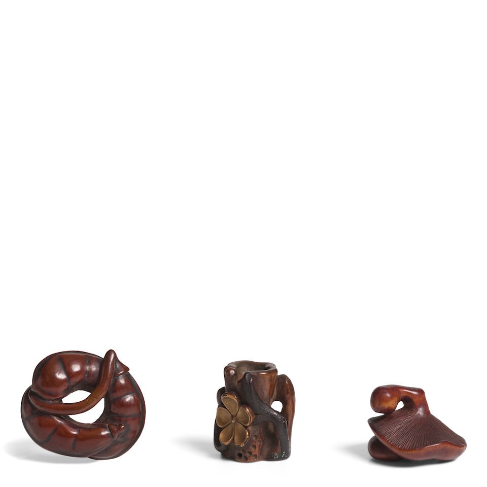 A LACQUERED-WOOD NETSUKE AND TWO WOOD NETSUKE Edo period (1615-1868) or Meiji era (1868-1912), 1...