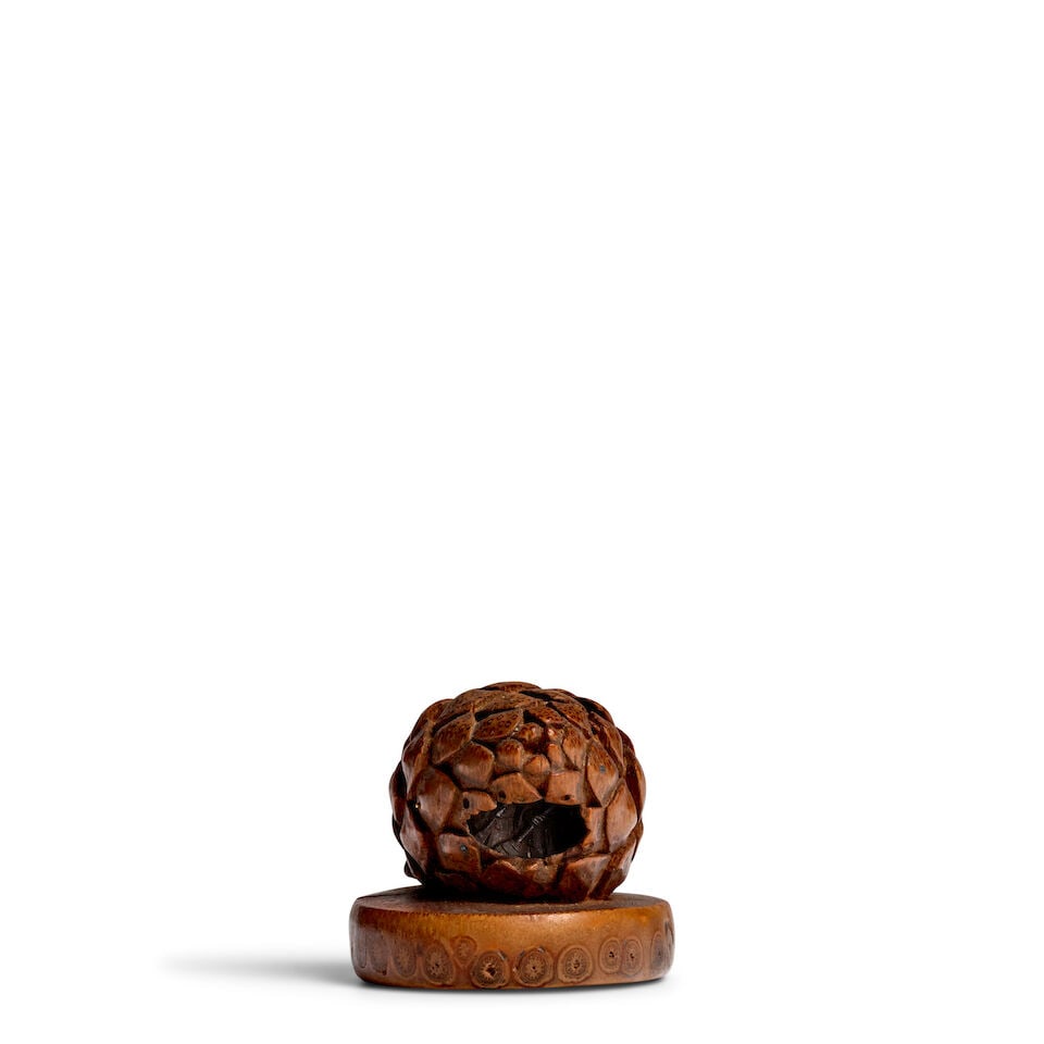 INABANOSUKE YOSHIOKA (DATES UNKNOWN) A Bamboo Netsuke of a Miniature Scene Inside a Pinecone Edo...