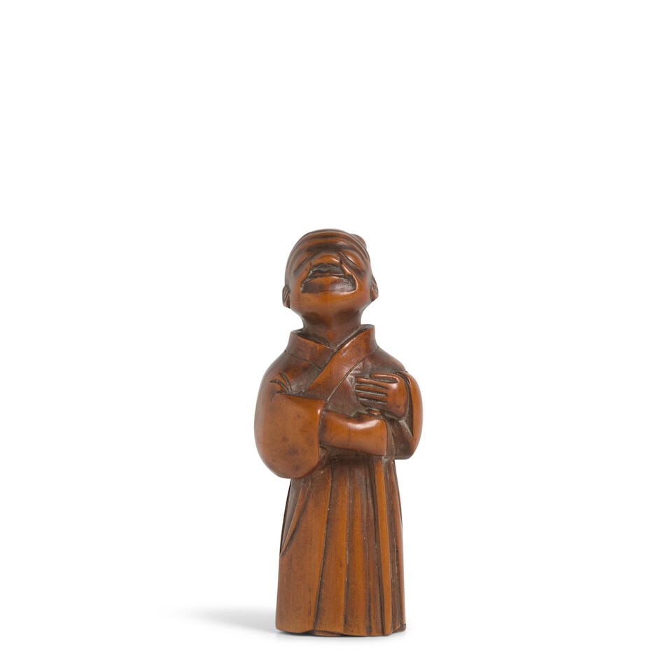 MINZAN (ACTIVE 19TH CENTURY) A Wood Netsuke of a Blind Man Edo period (1615-1868), 19th century