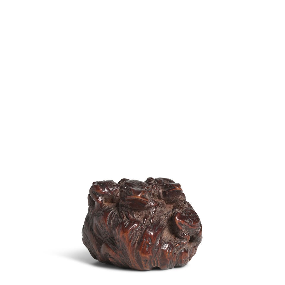 KOKEI (ACTIVE 19TH CENTURY) A Wood Netsuke of a Group of Frogs Edo period (1615-1868), 19th century