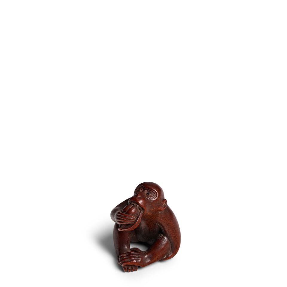 MASANAO OF ISE (ACTIVE 19TH CENTURY) A Wood Netsuke of a Seated Monkey Edo period (1615-1868), 1...
