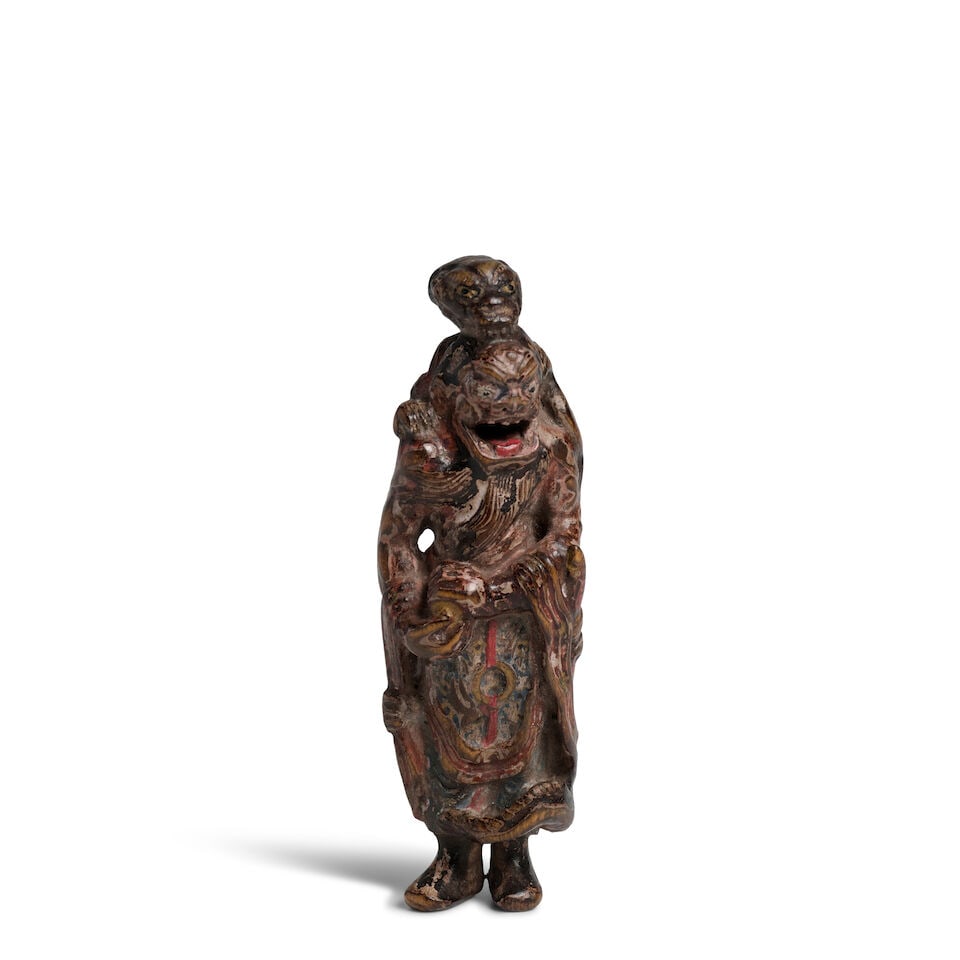 ATTRIBUTED TO YOSHIMURA SHŪZAN (ACTIVE LATE 18TH CENTURY) A Painted-Wood Netsuke of Ryū...