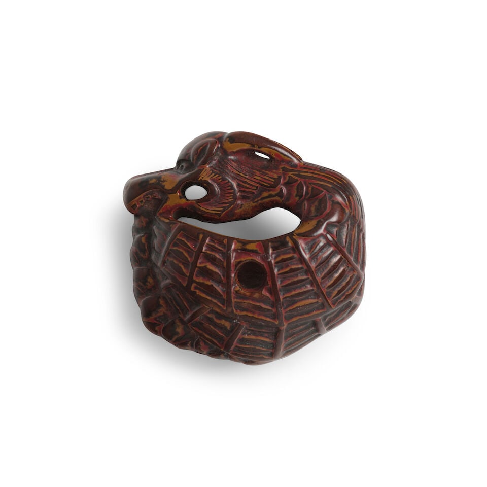 A LACQUERED-WOOD NETSUKE OF A SHACHIHOKO (DRAGON FISH) Edo period (1615-1868), 18th century