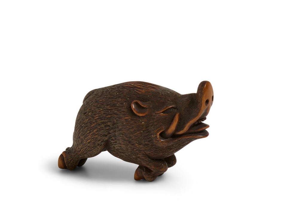 SHŪZAN (ACTIVE 19TH CENTURY) A Wood Netsuke of a Boar Edo period (1615-1868), 19th century