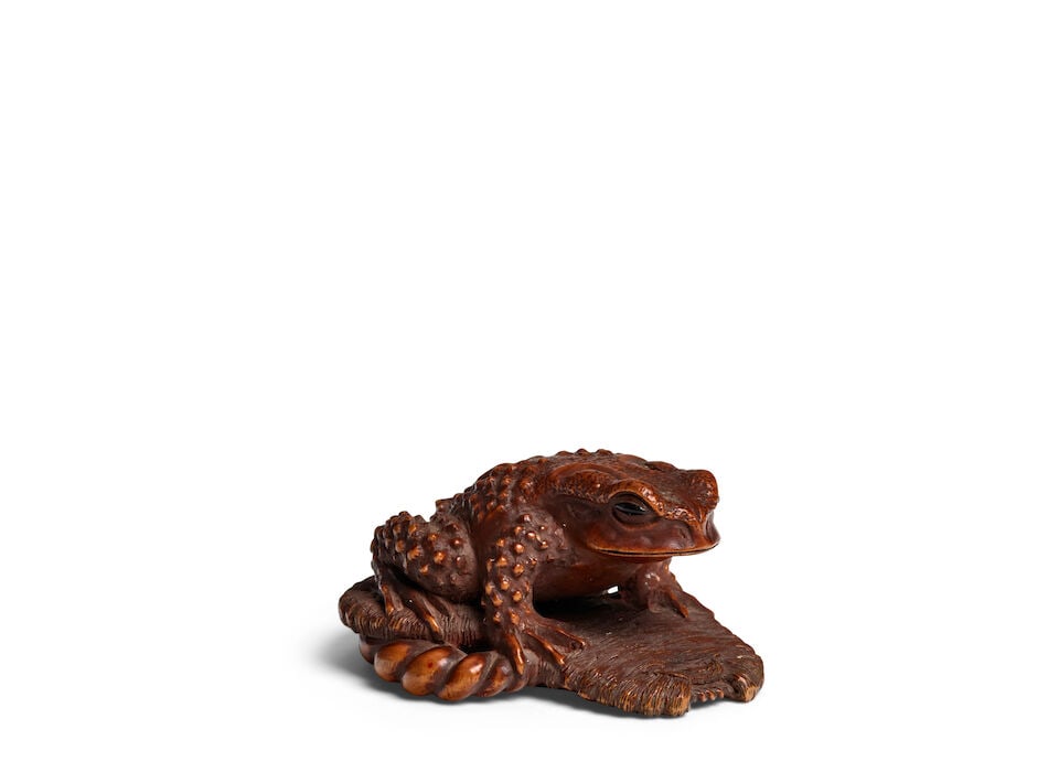 MASANAO OF ISE (ACTIVE 19TH CENTURY) A Wood Netsuke of a Toad on a Sandal Edo period (1615-1868)...