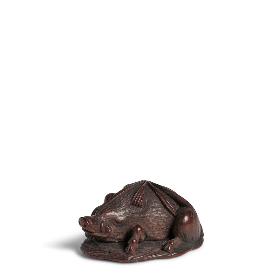 RYŪKŌSAI JUGYOKU II (1815-1877) A Wood Netsuke of a Sleeping Boar Edo period (1615-186...