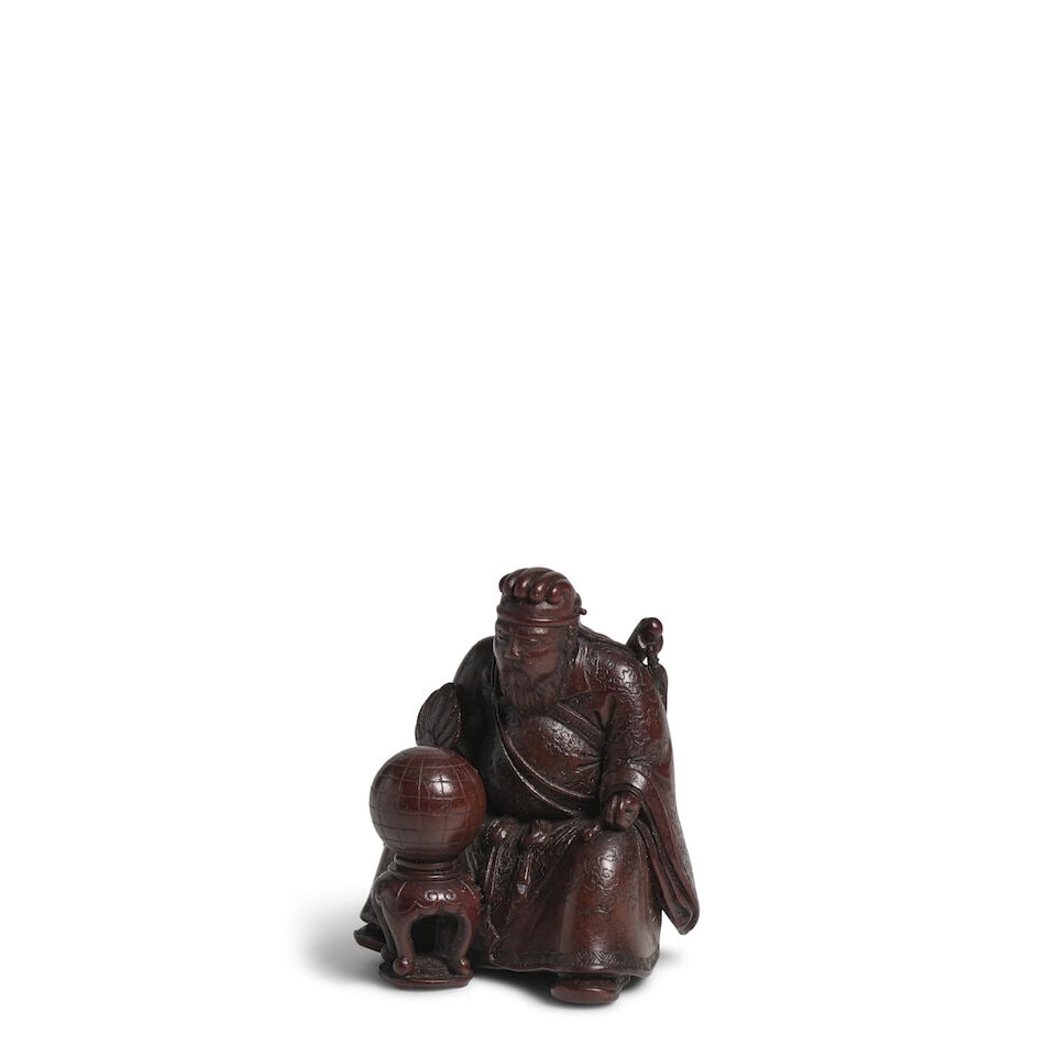 MEIKEISAI HŌJITSU (ACTIVE 19TH CENTURY) A Wood Netsuke of a Chinese Warrior Edo period (161...