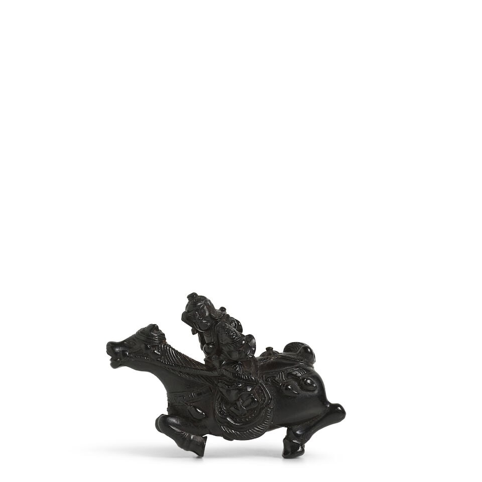 AN EBONY NETSUKE OF A MOUNTED WARRIOR Edo period (1615-1868), 19th century
