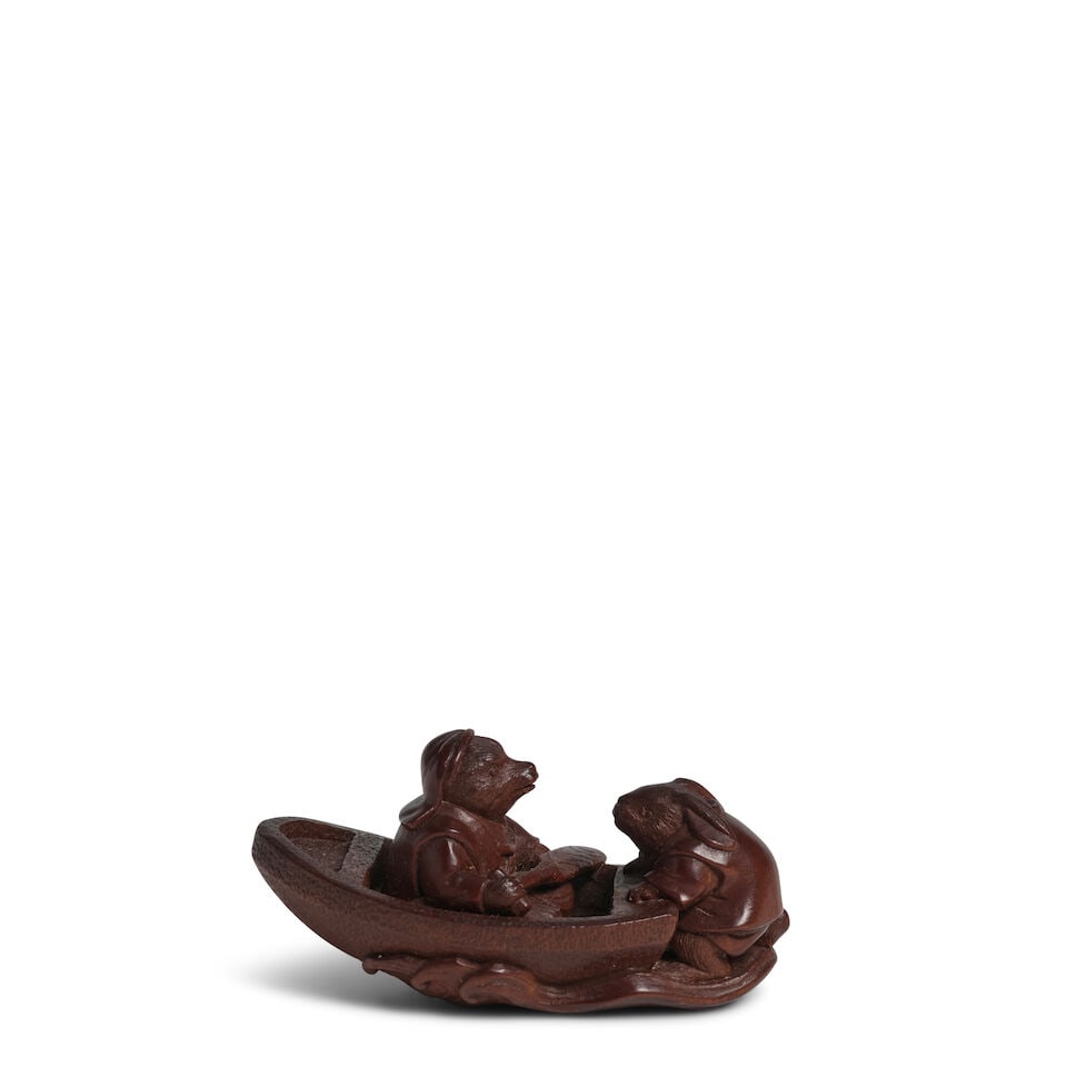 TSUKAMOTO KYOKUSAI (ACTIVE LATE 19TH CENTURY) A Wood Netsuke of a Hare and a Tanuki (Racoon Dog)...