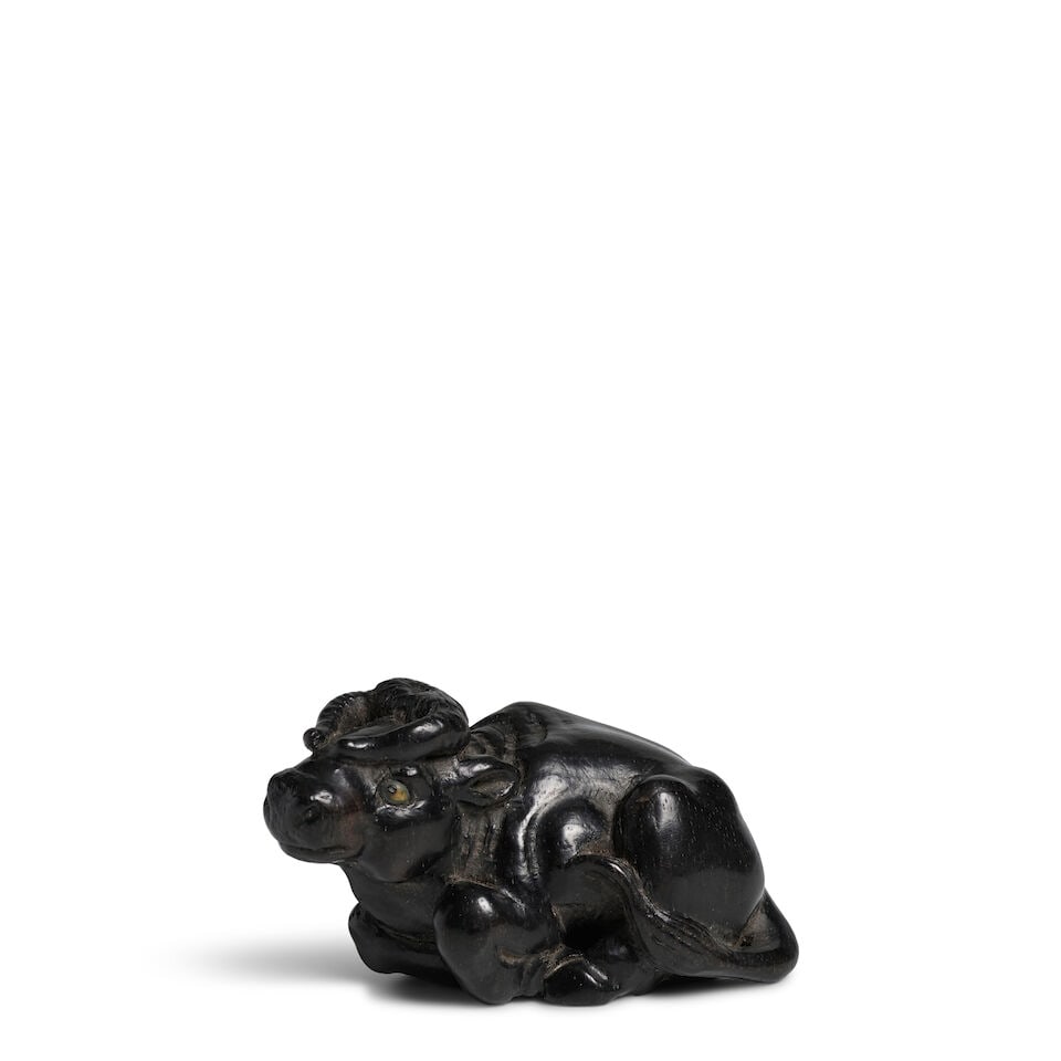 KOKEI (ACTIVE 19TH CENTURY) An Ebony Wood Netsuke of a Buffalo Edo period (1615-1868), 19th century