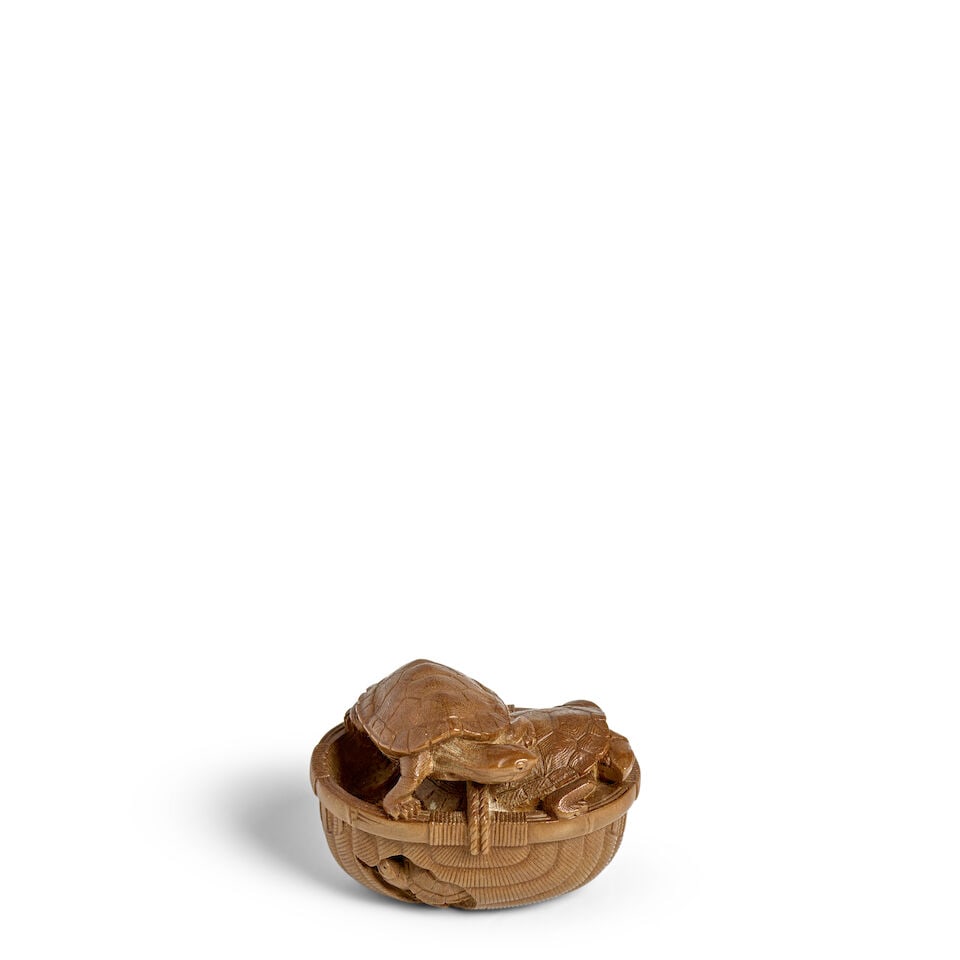 TADAKAZU (ACTIVE 19TH CENTURY) A Boxwood Netsuke of a Basket of Turtles Edo period (1615-1868), ...