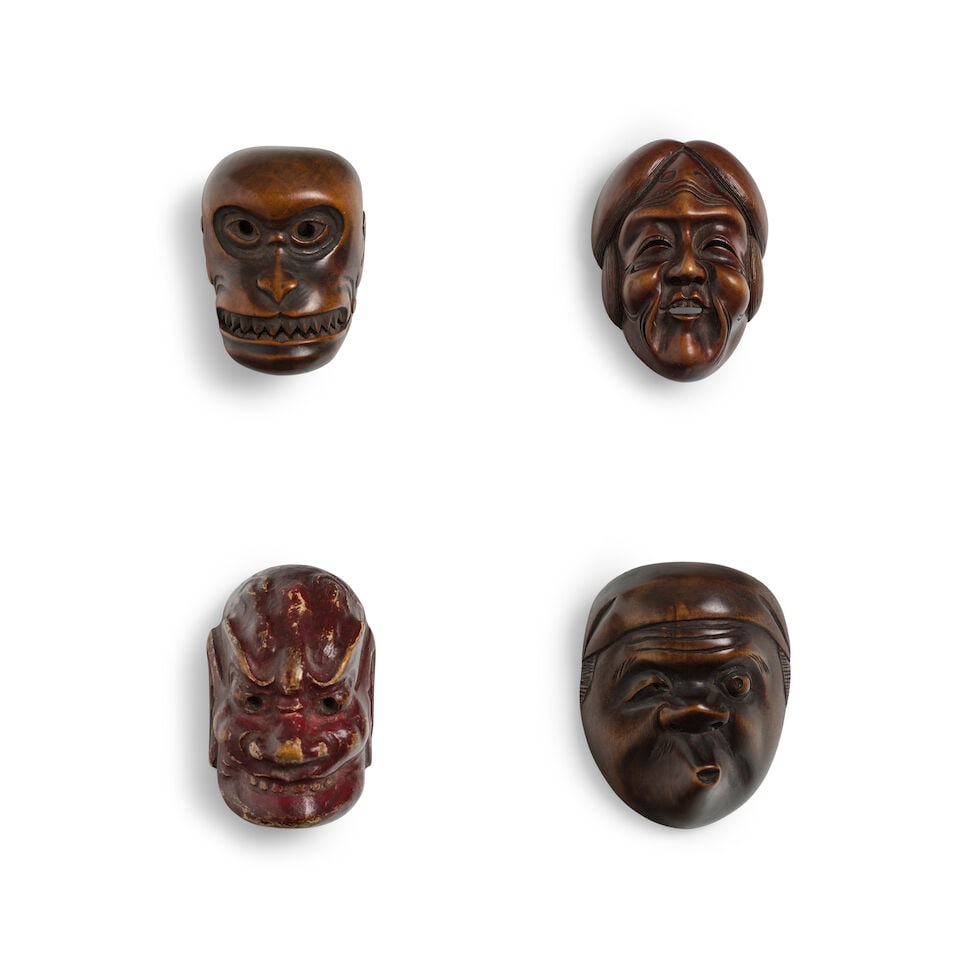 A PAINTED WOOD MASK NETSUKE AND THREE WOOD MASK NETSUKE Edo period (1615-1868) or Meiji era (186...