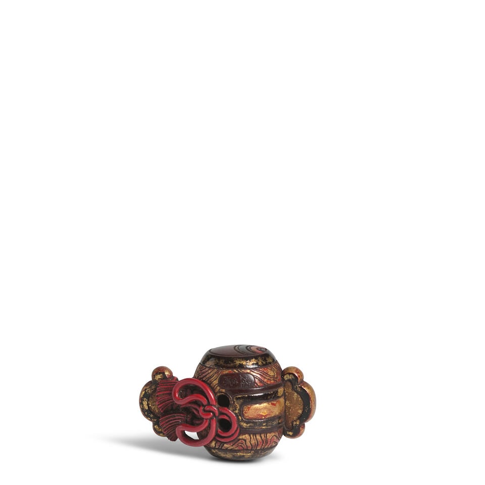 YŪSŌ (ACTIVE EARLY 20TH CENTURY) A Lacquered-Wood Netsuke of Daikoku's Mallet Taisho (...