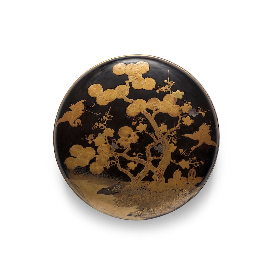 A CIRCULAR LACQUER BOX AND COVER Edo period (1615-1868), 18th/19th century: A CIRCULAR LACQUER BOX AND COVER Edo period (1615-1868), 18th/19th century Decorated in gold hiramaki-e with embellishments of gold and silver foil, kirikane, and hirame against a roiro-nuri ground wi