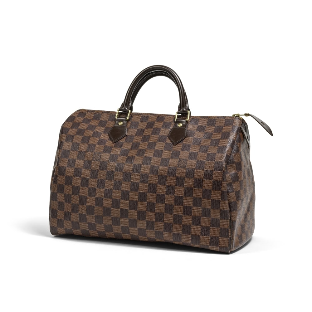 Louis Vuitton, année 2011. Sac Speedy en toile damier ébène. Louis Vuitton, year ...: Louis Vuitton, année 2011. Sac Speedy en toile damier ébène. Louis Vuitton, year 2011. Speedy bag in Damier Ebene canvas. Condition grade: B. 35 x 23 x 18,5 cm. Footnotes: Bon état
