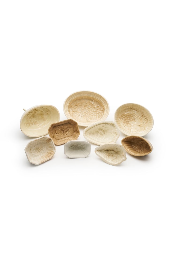 A group of nine Victorian and later ceramic jelly moulds of grapes, variously stamped with maker... (1 of 1)