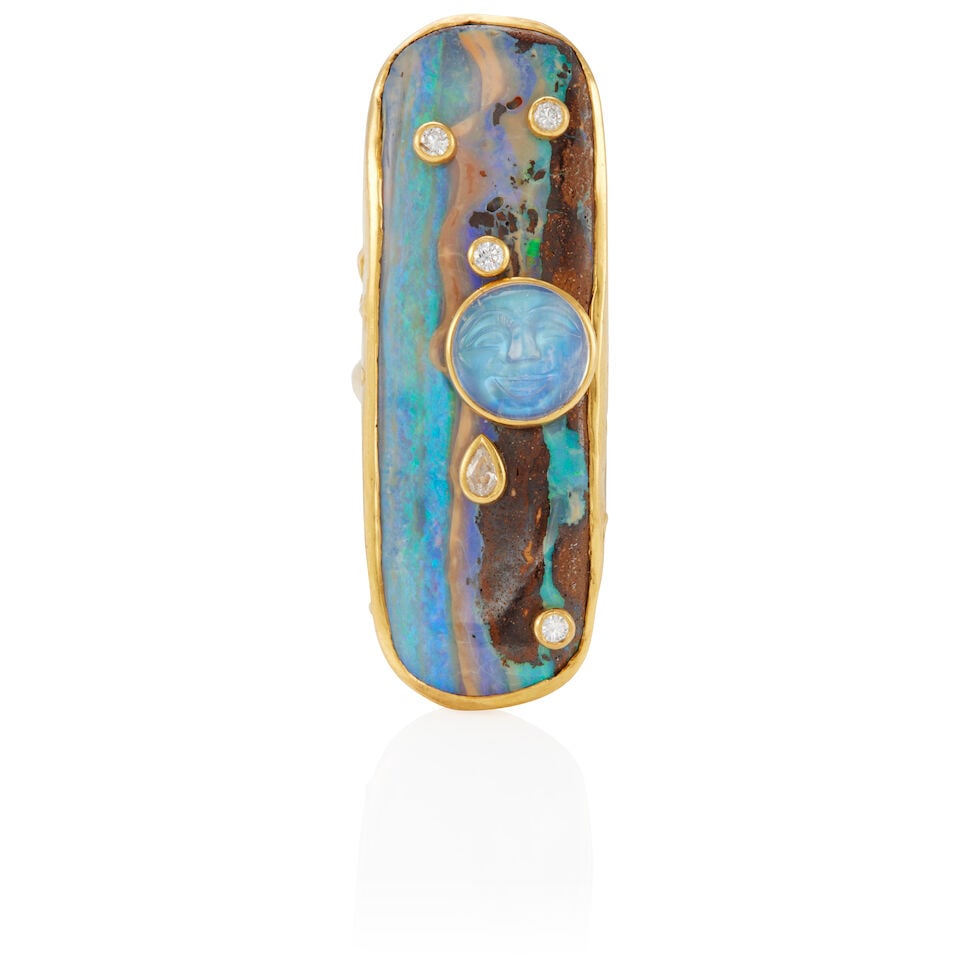 ATTRIBUTED TO SYLVIE CORBELIN: 22K GOLD, DIAMOND, AND GEM-SET RING: ATTRIBUTED TO SYLVIE CORBELIN: 22K GOLD, DIAMOND, AND GEM-SET RING • 22k yellow gold • 1 boulder opal doublet (59.00 x 19.90 x 6.60 mm) • 1 round carved cabochon moonstone (12.85 