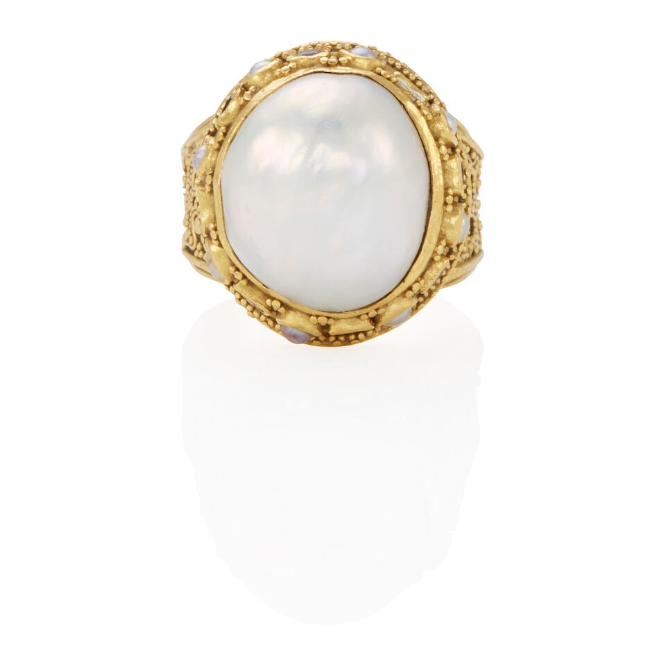 LUNA FELIX: 21K GOLD, PEARL, AND SPINEL RING: LUNA FELIX: 21K GOLD, PEARL, AND SPINEL RING • 21k yellow gold • 1 oval shaped cultured blister pearl measuring approximately 17.50 x 15.03 x 7.72 mm • 8 semi-spherical cultured pear