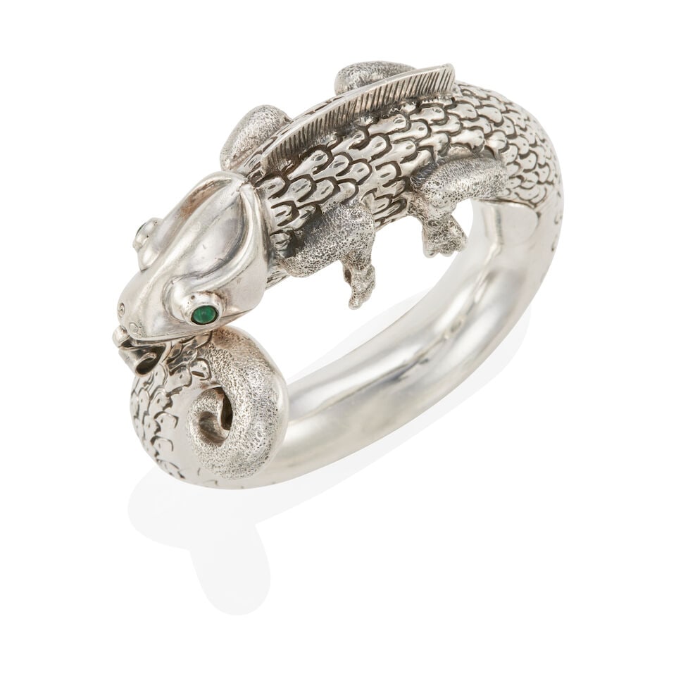 MEXICAN STERLING SILVER AND MALACHITE 'GECKO' HINGED BANGLE BRACELET: MEXICAN STERLING SILVER AND MALACHITE 'GECKO' HINGED BANGLE BRACELET • Sterling silver • 2 round cabochon malachites (4.30 mm each) • Inner circumference: 6 ¾ in. • Estima