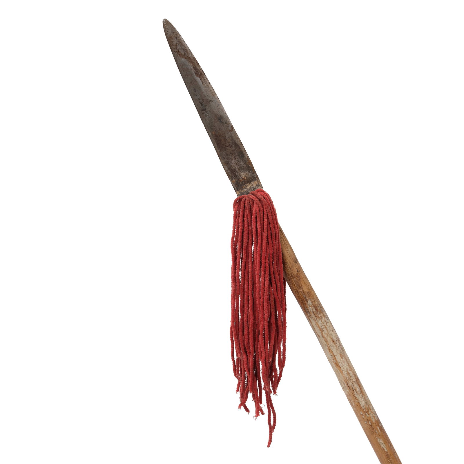 A Southern Plains or Pueblo lance: A Southern Plains or Pueblo lance The wood shaft with remnants of white pigment throughout, with iron collar and blade, red fabric tassels attached at the base of the blade. length 70 5/8in, width 1 1