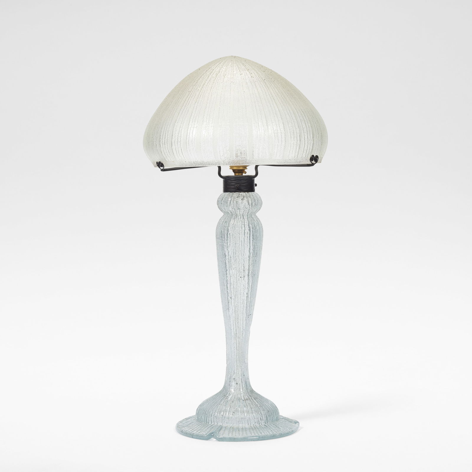 DAUM Nancy Table lamp, circa 1925: DAUM Nancy Table lamp, circa 1925 Acid etched glass, the mushroom shaped shade raised on a baluster shaped stem, deeply etched with vertical grooving. 67 cm high, 34 cm diameter Signed Daum Nancy Fran