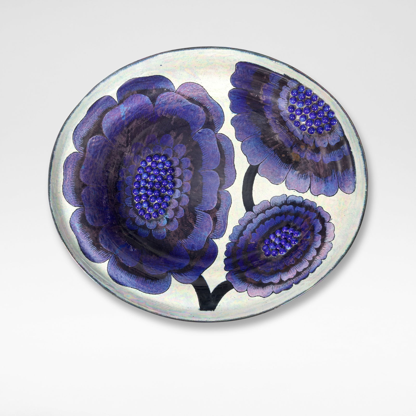 Birger Kaipiainen Charger, circa 1960: Birger Kaipiainen Charger, circa 1960 Stoneware, white and blue lustre glazes decorated with stylised motifs of dahlias, with applied and glazed pearls in relief. 57 cm high, 66 cm wide, 13.5 cm high