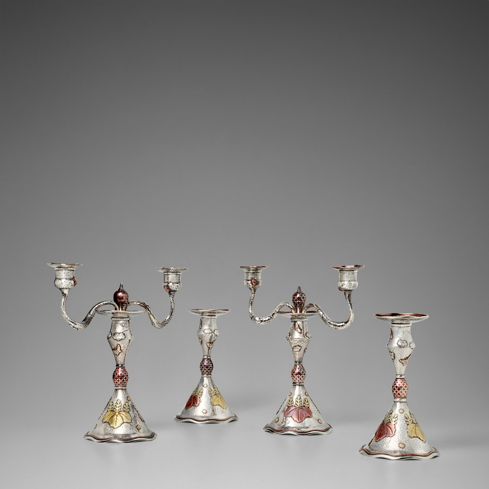 TIFFANY & CO. (EST. 1837) Important Suite of Two Twin-Branched Candelabra and Two Candlesticks, ...: TIFFANY & CO. (EST. 1837) Important Suite of Two Twin-Branched Candelabra and Two Candlesticks, Commissioned by Mary Jane Morgan circa 1878 silver and mixed metals, in the Japanesque taste, decorated