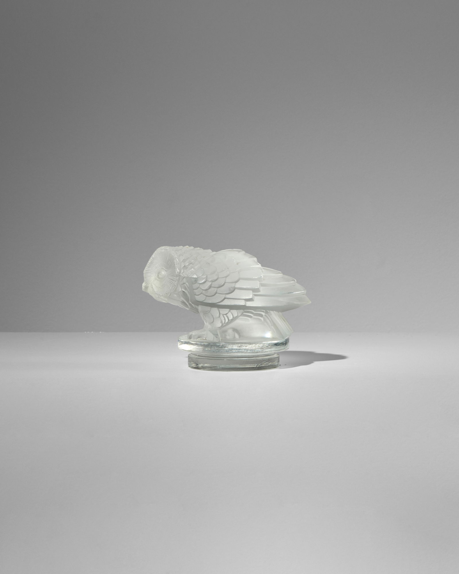RENÉ LALIQUE (1860-1945) Hibou (Owl) designed 1931 Marcilhac 1181, clear and frosted glass,...: RENÉ LALIQUE (1860-1945) Hibou (Owl) designed 1931 Marcilhac 1181, clear and frosted glass, hand finished, acid stamp 'R.LALIQUE FRANCE' height 3 1/2in (9cm); length 5in (12.8cm) Footnotes: Prov