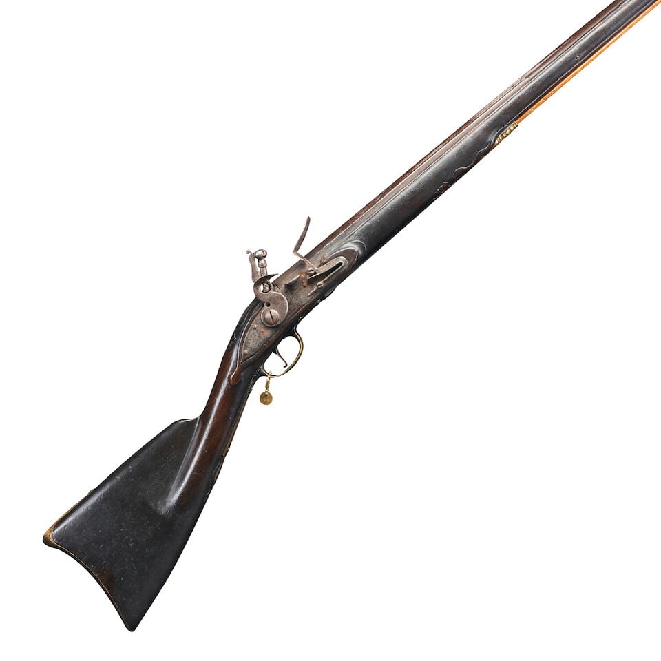 A HUDSON VALLEY FOWLER,: A HUDSON VALLEY FOWLER, mid-18th century. 56 in., .72 caliber barrel with sculpted foliate scroll decoration at the breech and raised rib extending to the front blade sight; flat lock plate with