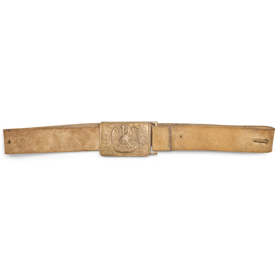 A CIVIL WAR LOUISIANA BELT AND BUCKLE.: A CIVIL WAR LOUISIANA BELT AND BUCKLE. The die stamped plate with a pelican flanked by a wreath, lead filled back with sheet brass hook and tabs, mounted on a 1 1/2 in., buff leather belt. For