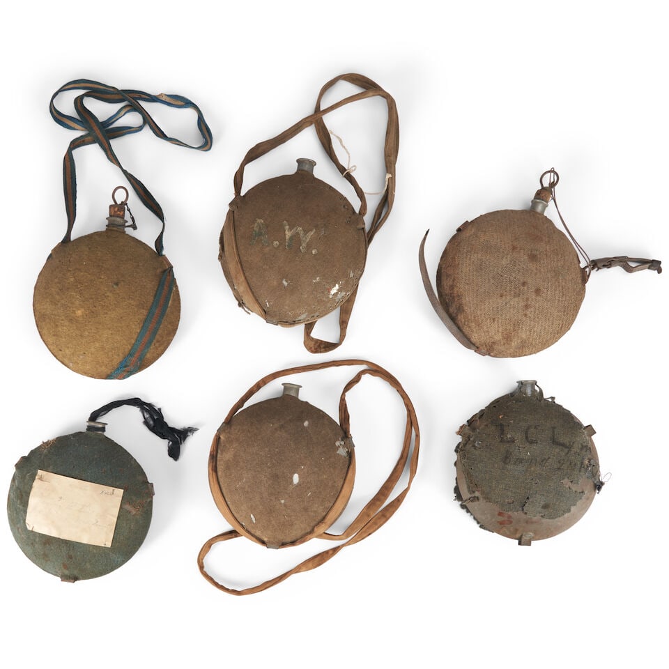 SIX MODEL 1858 SMOOTH SIDED CANTEENS.: SIX MODEL 1858 SMOOTH SIDED CANTEENS. With cloth covers, two with inscriptions, one with an old note noting that the canteen was used during the Civil War by John Babcock of Co. C. 4th Massachusetts