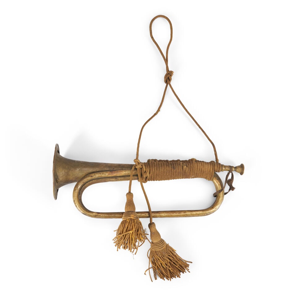 A CIVIL WAR KLEMM AND BROTHERS BUGLE WITH CAVALRY CORDS,: A CIVIL WAR KLEMM AND BROTHERS BUGLE WITH CAVALRY CORDS, Philadelphia, Pennsylvania, 1860s. The brass bugle with detachable mouthpiece marked 'KLEMM & BRO/PHILAD.' Lg. 15 1/2 in. For further