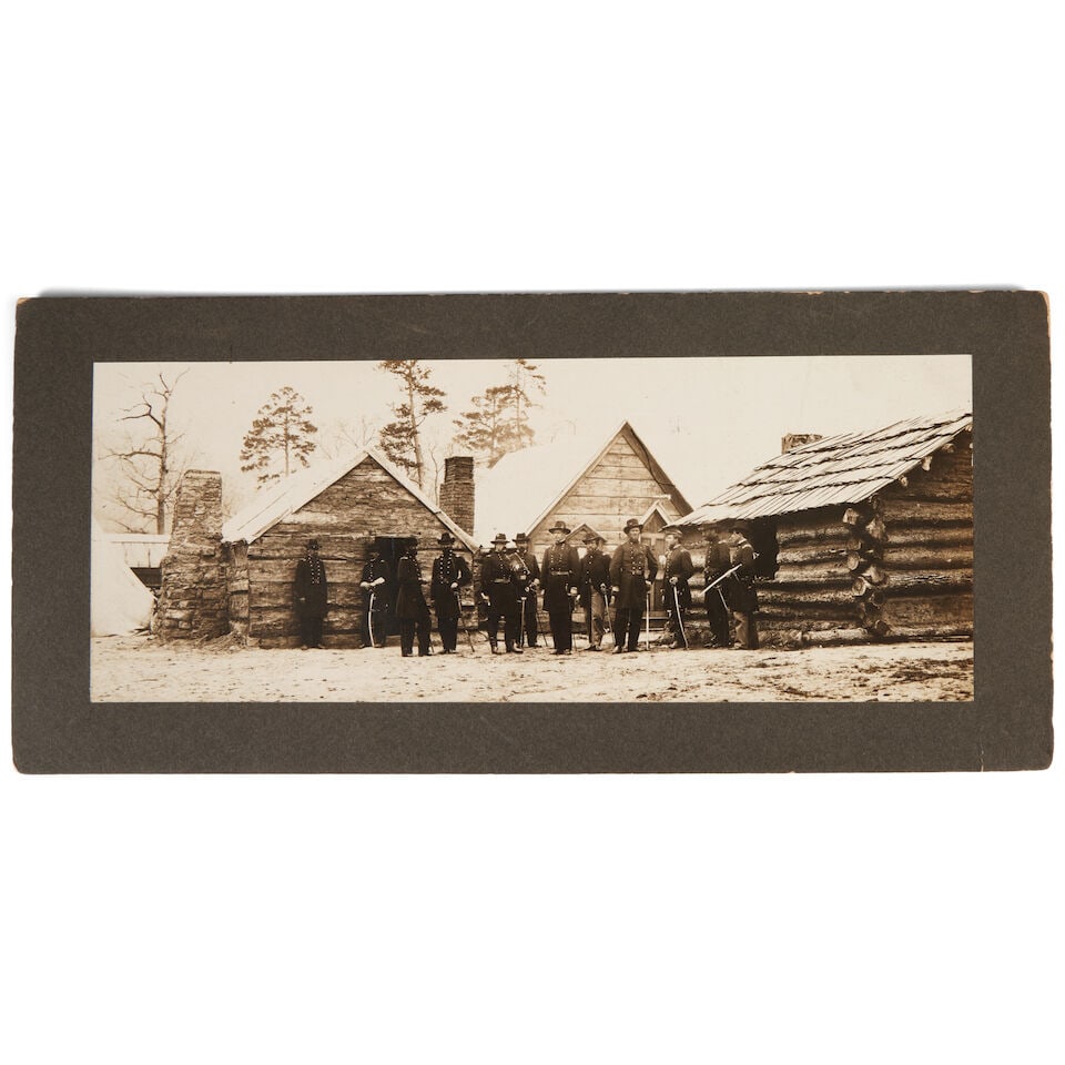 A PHOTOGRAPH OF GENERAL JOSEPH HOOKER AND STAFF IN WINTER QUARTERS AT LOOKOUT VALLEY 1863-64.: A PHOTOGRAPH OF GENERAL JOSEPH HOOKER AND STAFF IN WINTER QUARTERS AT LOOKOUT VALLEY 1863-64. The image mounted on a dark gray card inscribed on the back 'Maj Gen. Joe Hooker & Staff in winter