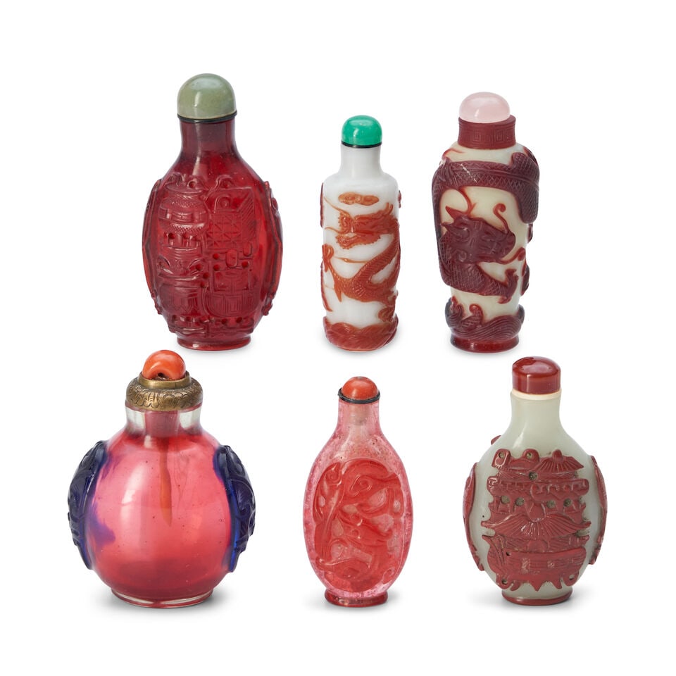 Six Red Overlay Glass Snuff Bottles, China, (6): Six Red Overlay Glass Snuff Bottles, China, A round bottle with lion mask handles; a flattened ovoid bottle with censers; a ovoid bottle with dragons; an ovoid bottle with censers; a cylindrical