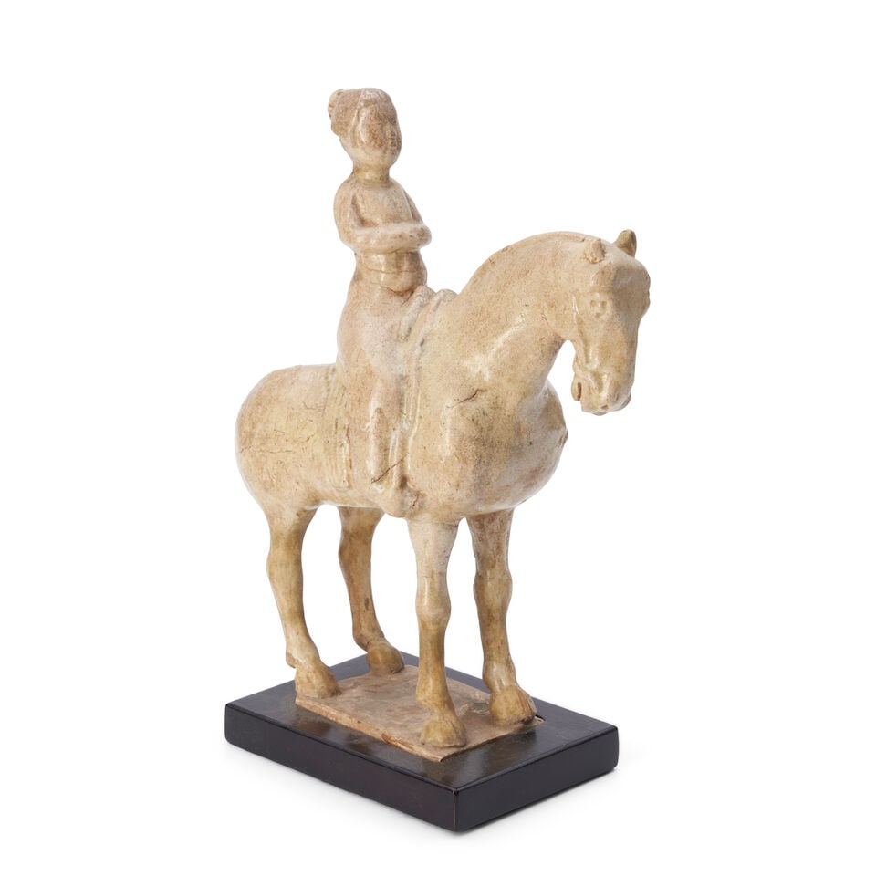 A Cream-glazed Horse and Rider China, possibly Tang dynasty, (1 of 3)