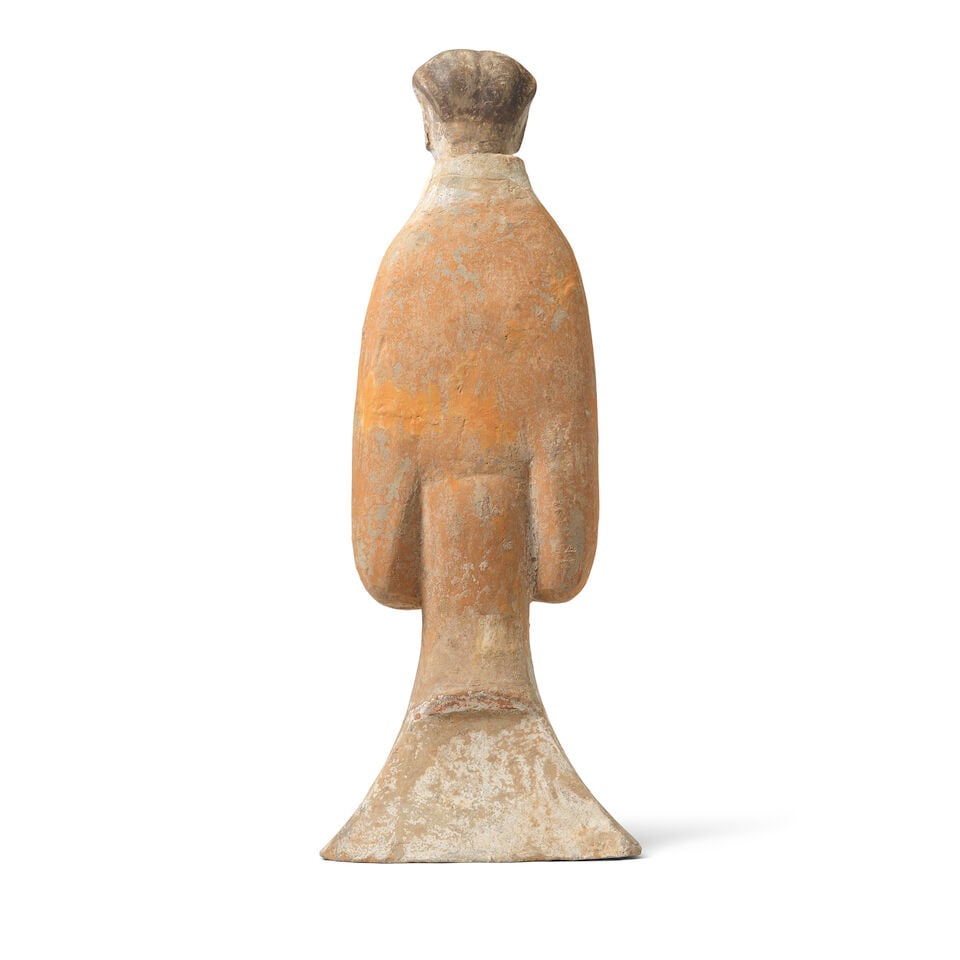 A LARGE POTTERY MODEL OF AN ATTENDANT Han Dynasty - 2