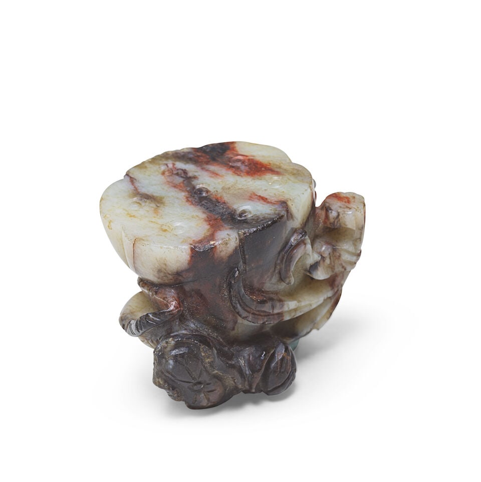 A CREAM AND BROWN JADE LOTUS CARVING 18th/19th Century - 2