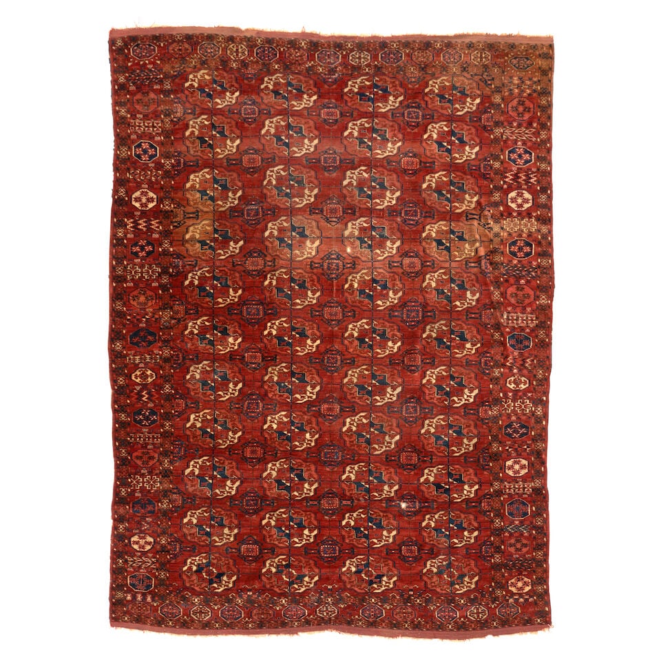 Tekke Main Carpet Turkestan 6 ft. 7 in. x 9 ft.: Tekke Main Carpet Turkestan c. 1850, with fuzzy pile and old natural colors. 6 ft. 7 in. x 9 ft. For further information on this lot please visit Bonhams.com For further information about this lot