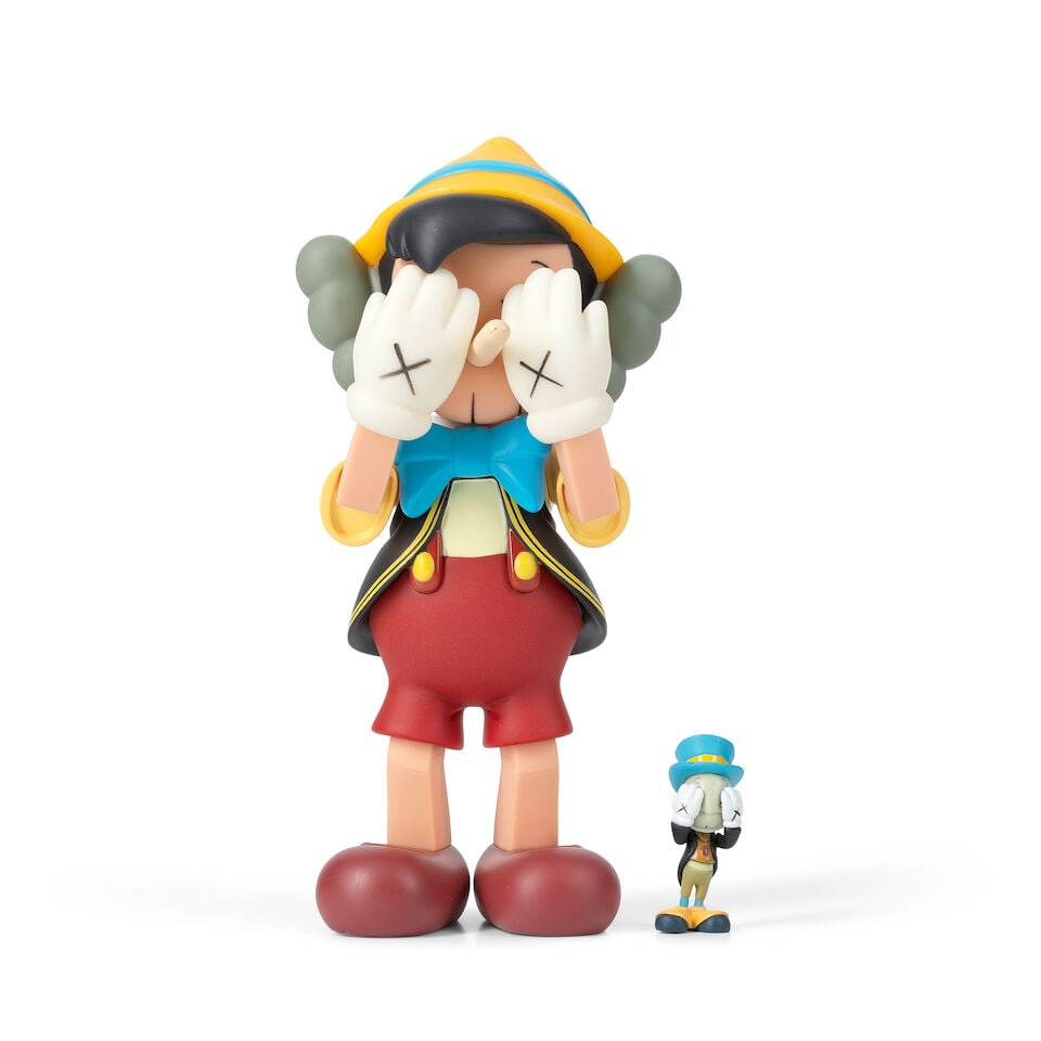 KAWS (American, born 1974) Pinocchio and Jiminy Cricket The complete set of two painted vinyl ca...: KAWS (American, born 1974) Pinocchio and Jiminy Cricket (Ramirez-Montagut p. 40) The complete set of two painted vinyl cast multiples, 2010, each with the artist's name, date, fabricator and