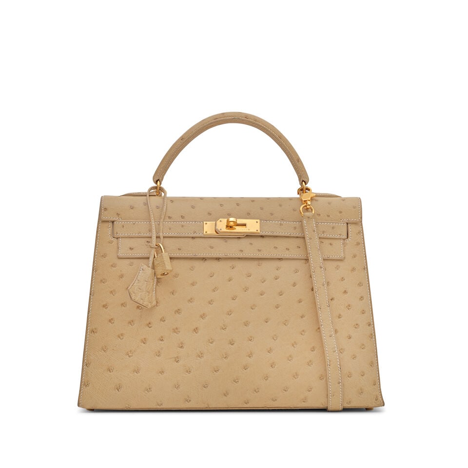 Hermès: a Parchemin Ostrich Sellier Kelly 32 1997 (includes padlock, keys, cloche and dust ...: Hermès: a Parchemin Ostrich Sellier Kelly 32 1997 Gold tone hardware Condition Grade B+ 32cm wide, 23cm high, 12cm deep, 8cm handle drop, 44cm shoulder drop, includes padlock, keys, cloche and