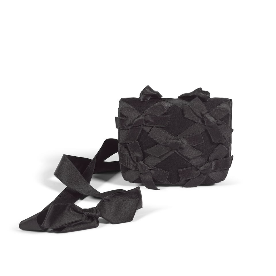 Chanel: a Black Silk Satin Bow Flap Bag 1994 (includes serial sticker, authenticity card and bo... (1 of 2)