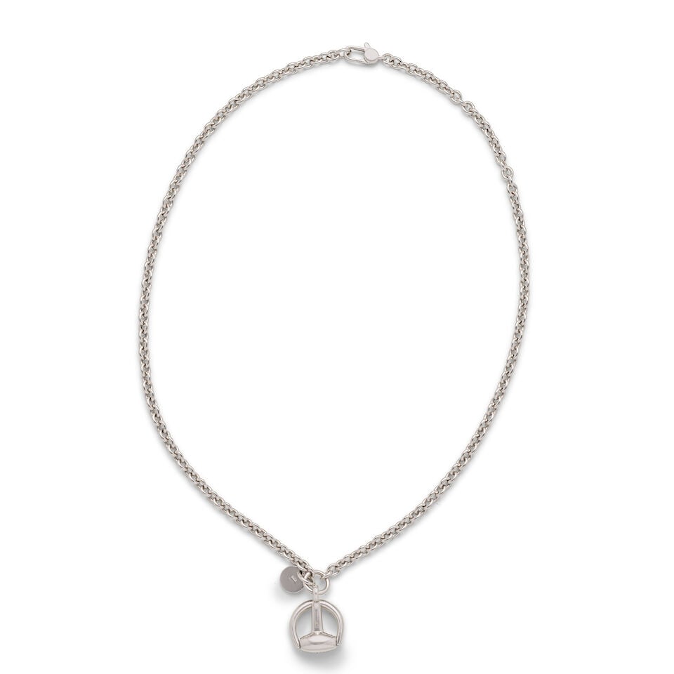 Gucci: a White Gold and Diamond Horsebit Necklace: Gucci: a White Gold and Diamond Horsebit Necklace 18kt white gold pendant studded with approx. 0.39 carat diamonds Condition Grade A- Pendant 3cm high, chain 20cm drop For further information on