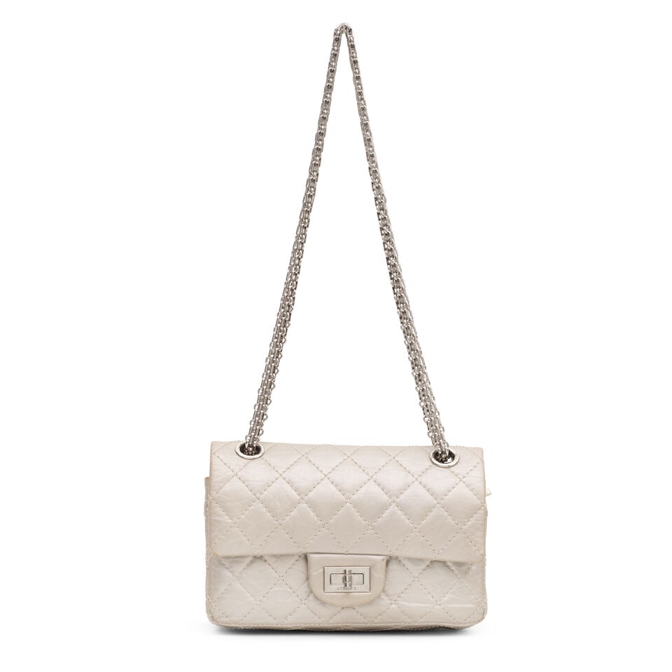 Chanel: a Pale Gold Leather Small Reissue Flap Bag 2011-12 (includes serial sticker, authenticit...: Chanel: a Pale Gold Leather Small Reissue Flap Bag 2011-12 Creative Director: Karl Lagerfeld Quilted pale gold crinkle calf skin leather with silver tone hardware and bijoux chain strap Condition Grad